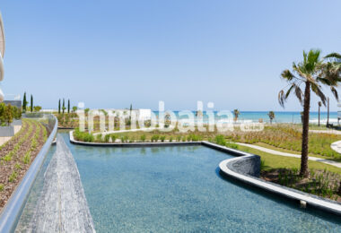 Luxurious beachfront apartment with private garden