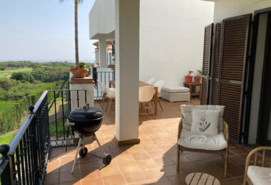 Frontline golf ground-floor apartment with stunning views in La Alcaidesa, near Sotogrande, Cadiz