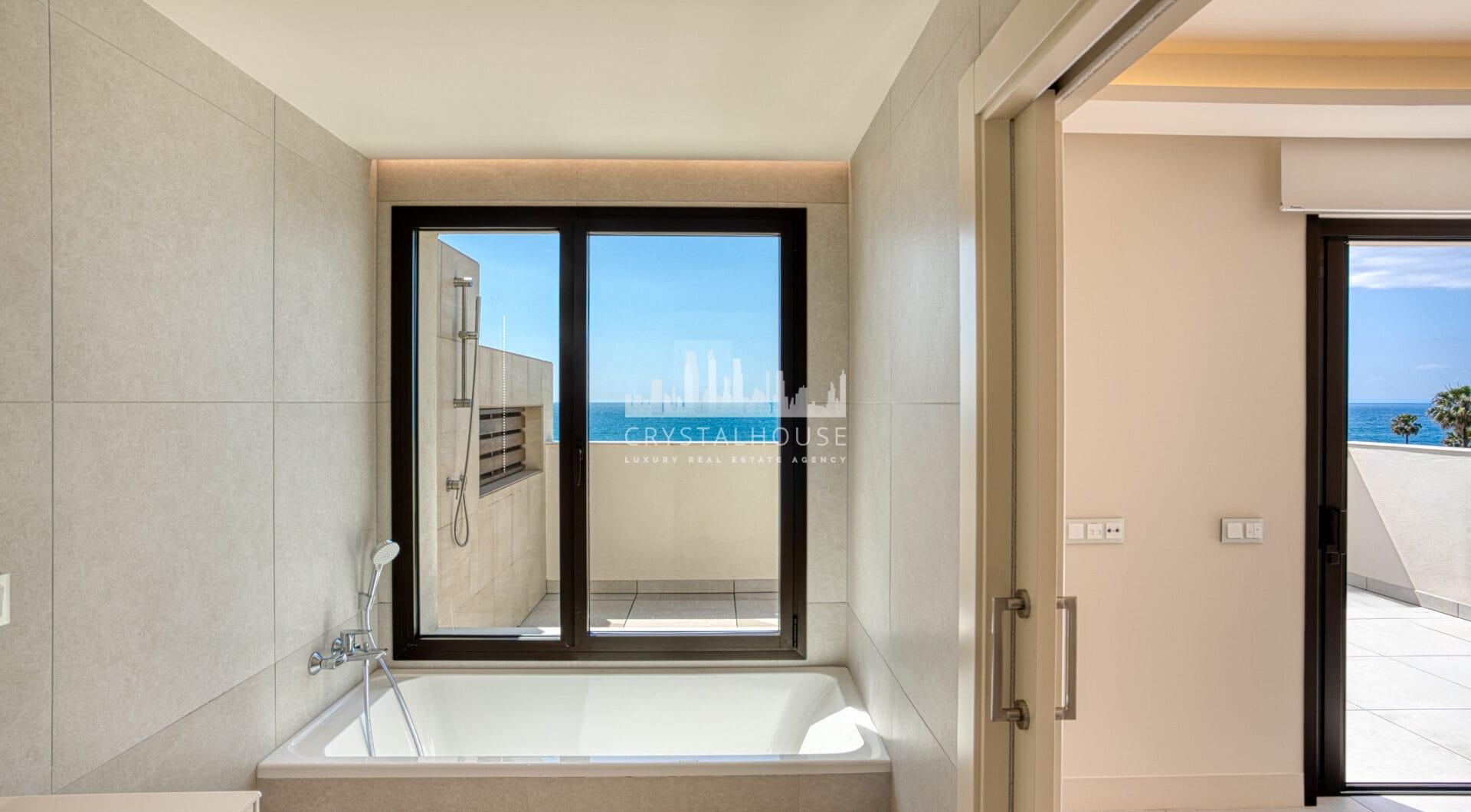 Luxurious four-bedroom duplex penthouse located in a beachfront community on Marbella’s prestigious New Golden Mile with sea views