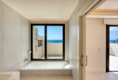 Luxurious four-bedroom duplex penthouse located in a beachfront community on Marbella’s prestigious New Golden Mile with sea views