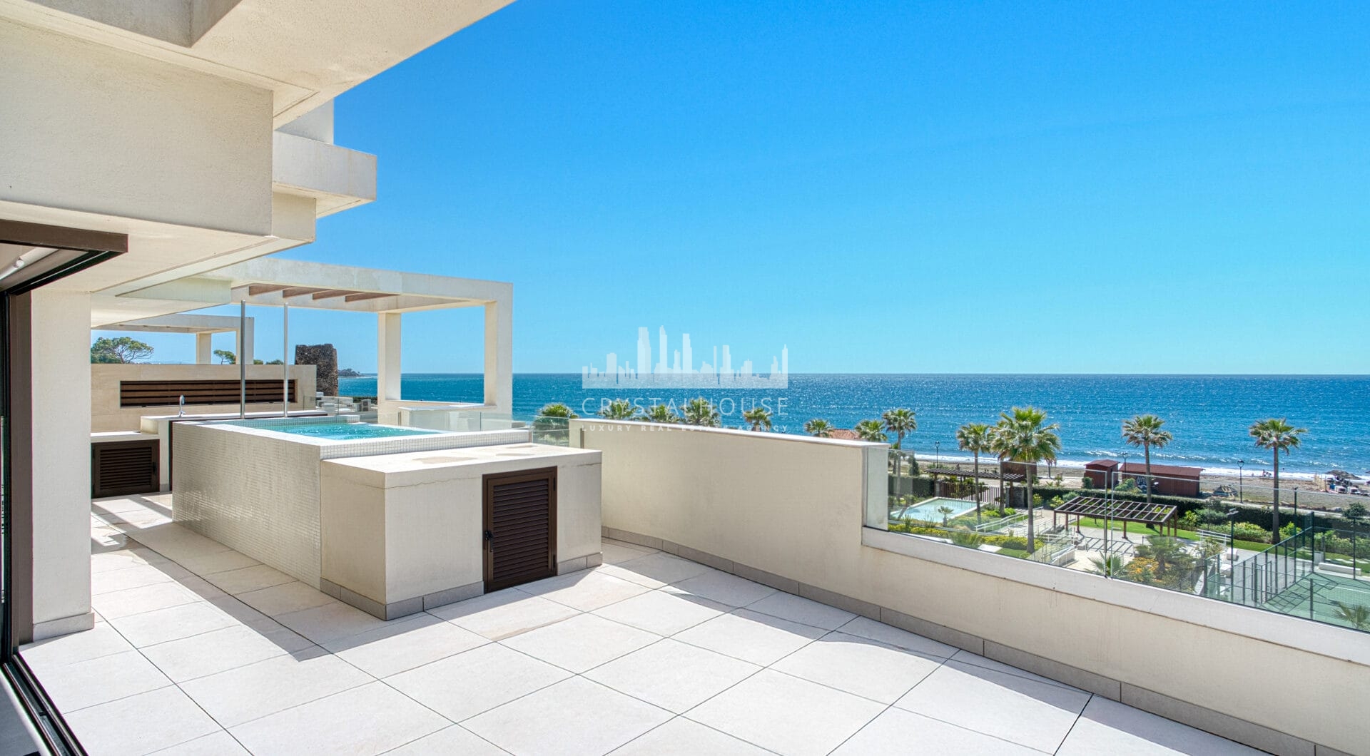 Luxurious four-bedroom duplex penthouse located in a beachfront community on Marbella’s prestigious New Golden Mile with sea views