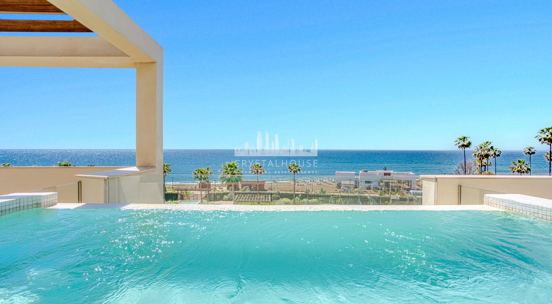 Luxurious four-bedroom duplex penthouse located in a beachfront community on Marbella’s prestigious New Golden Mile with sea views