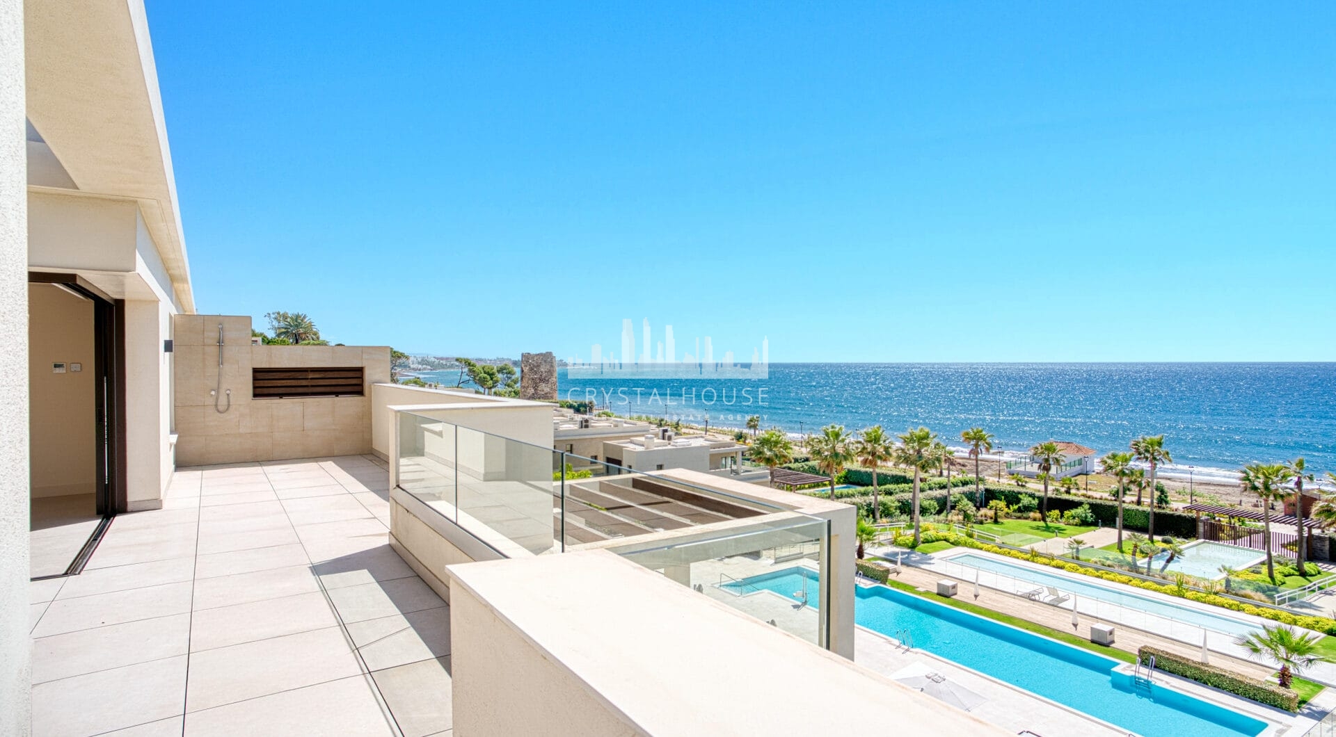Luxurious four-bedroom duplex penthouse located in a beachfront community on Marbella’s prestigious New Golden Mile with sea views