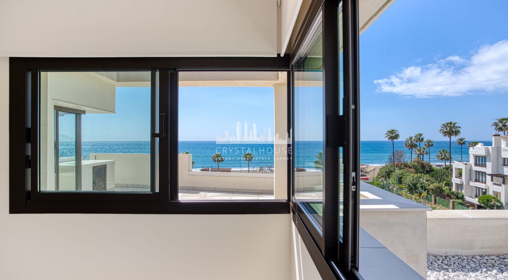 Luxurious four-bedroom duplex penthouse located in a beachfront community on Marbella’s prestigious New Golden Mile with sea views