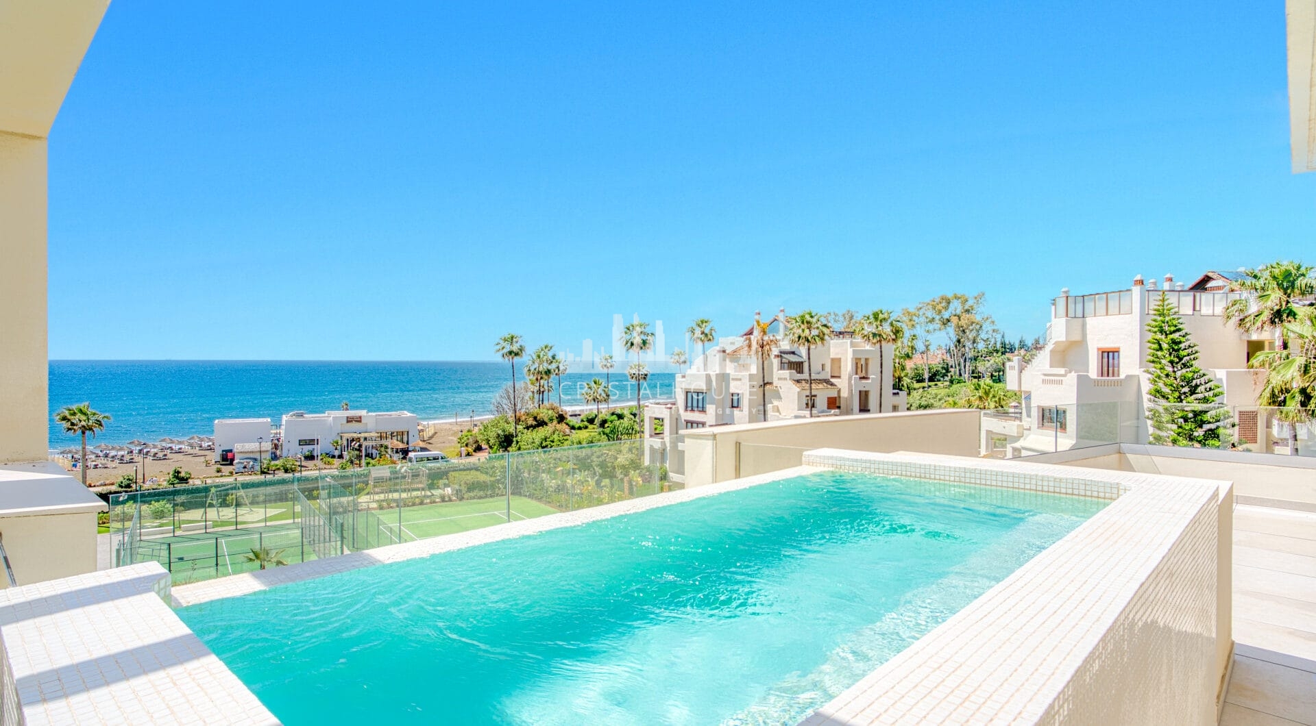 Luxurious four-bedroom duplex penthouse located in a beachfront community on Marbella’s prestigious New Golden Mile with sea views