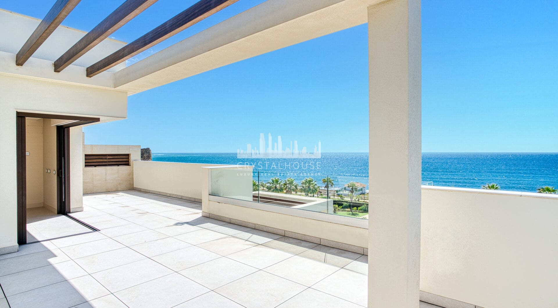 Luxurious four-bedroom duplex penthouse located in a beachfront community on Marbella’s prestigious New Golden Mile with sea views