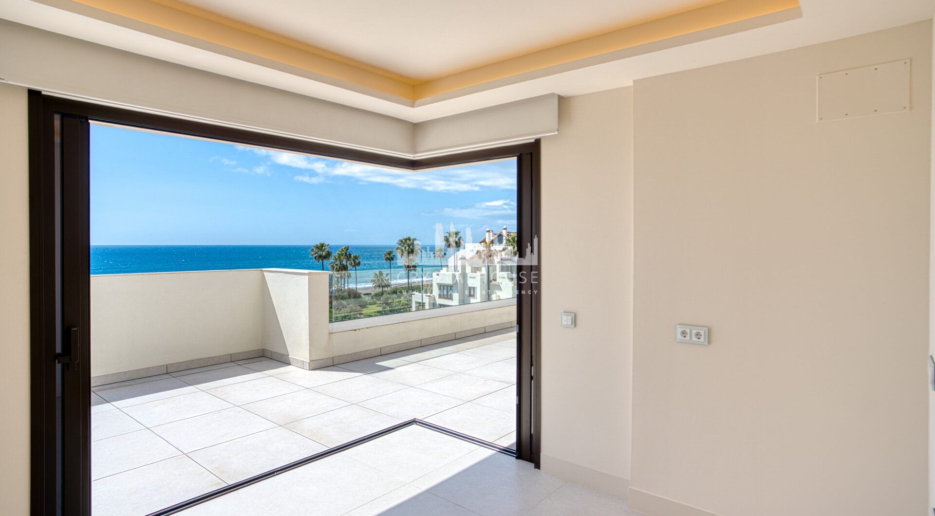 Luxurious four-bedroom duplex penthouse located in a beachfront community on Marbella’s prestigious New Golden Mile with sea views