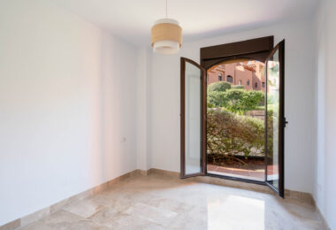 Elegant Coastal Living in Estepona – Corner Garden Apartment with Style &amp; Serenity in Costa Galera