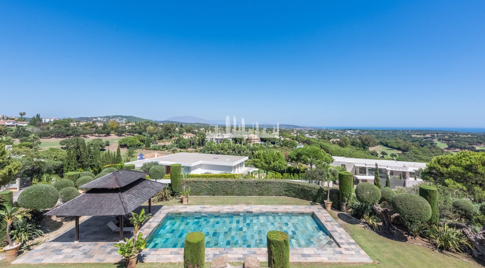 A superb villa built on an elevated site with outstanding panoramic views over golf courses to mountains and the sea.