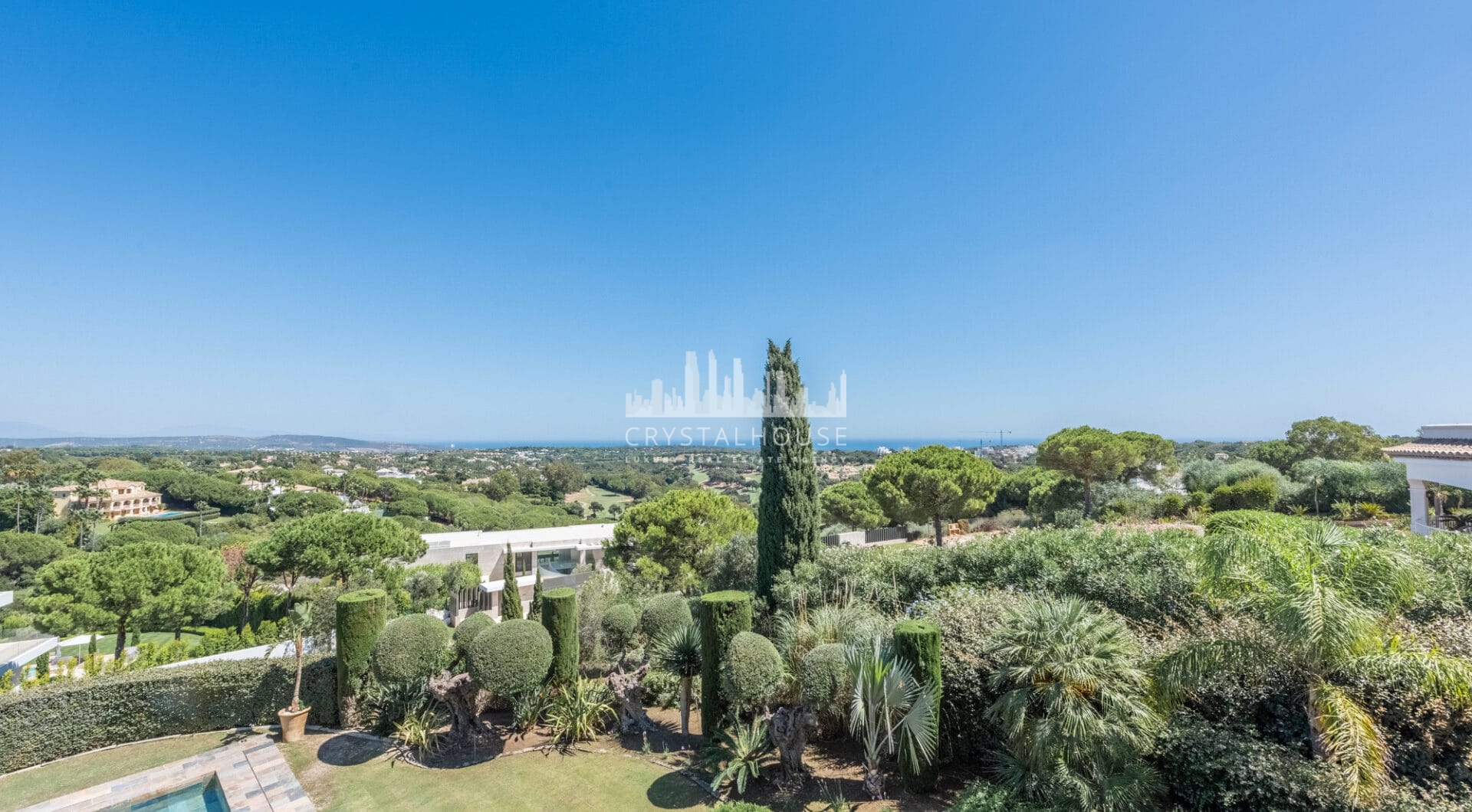 A superb villa built on an elevated site with outstanding panoramic views over golf courses to mountains and the sea.