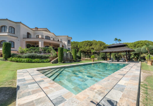 A superb villa built on an elevated site with outstanding panoramic views over golf courses to mountains and the sea.
