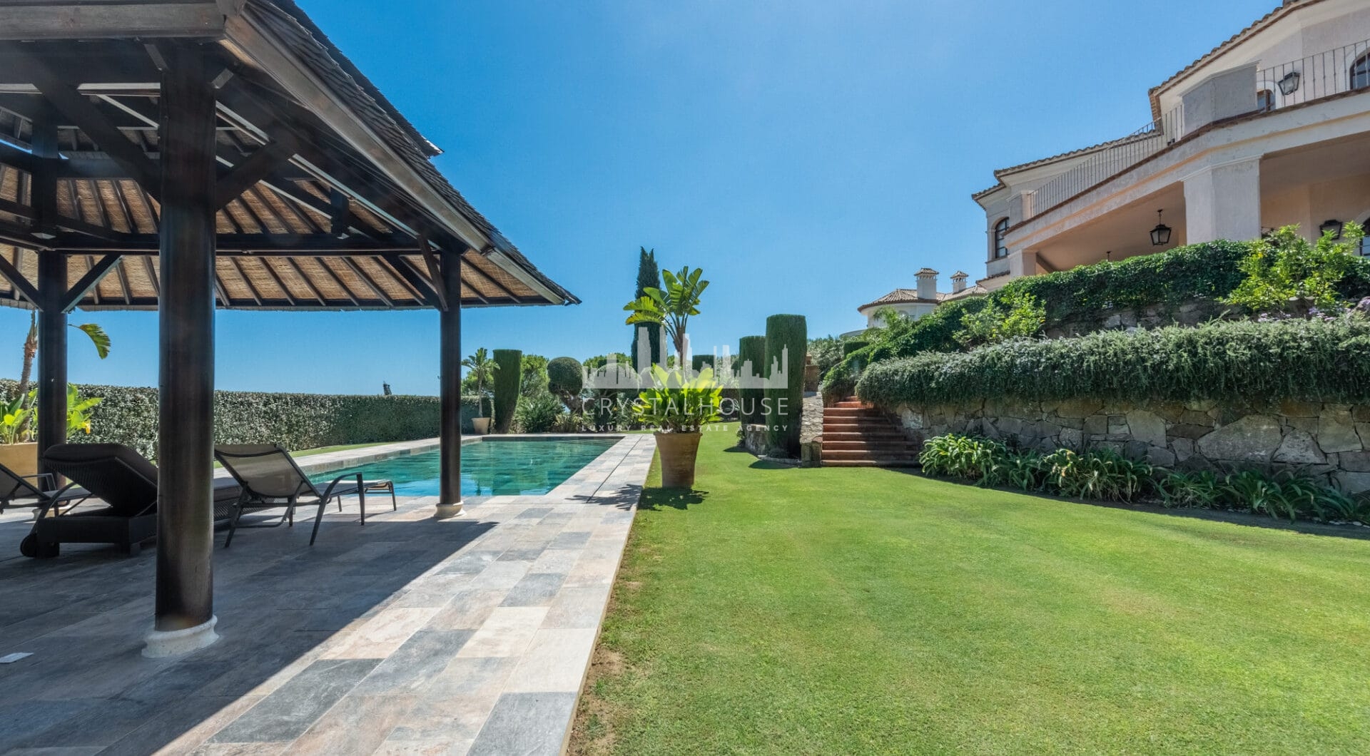 A superb villa built on an elevated site with outstanding panoramic views over golf courses to mountains and the sea.