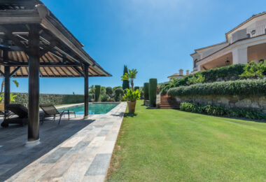 A superb villa built on an elevated site with outstanding panoramic views over golf courses to mountains and the sea.