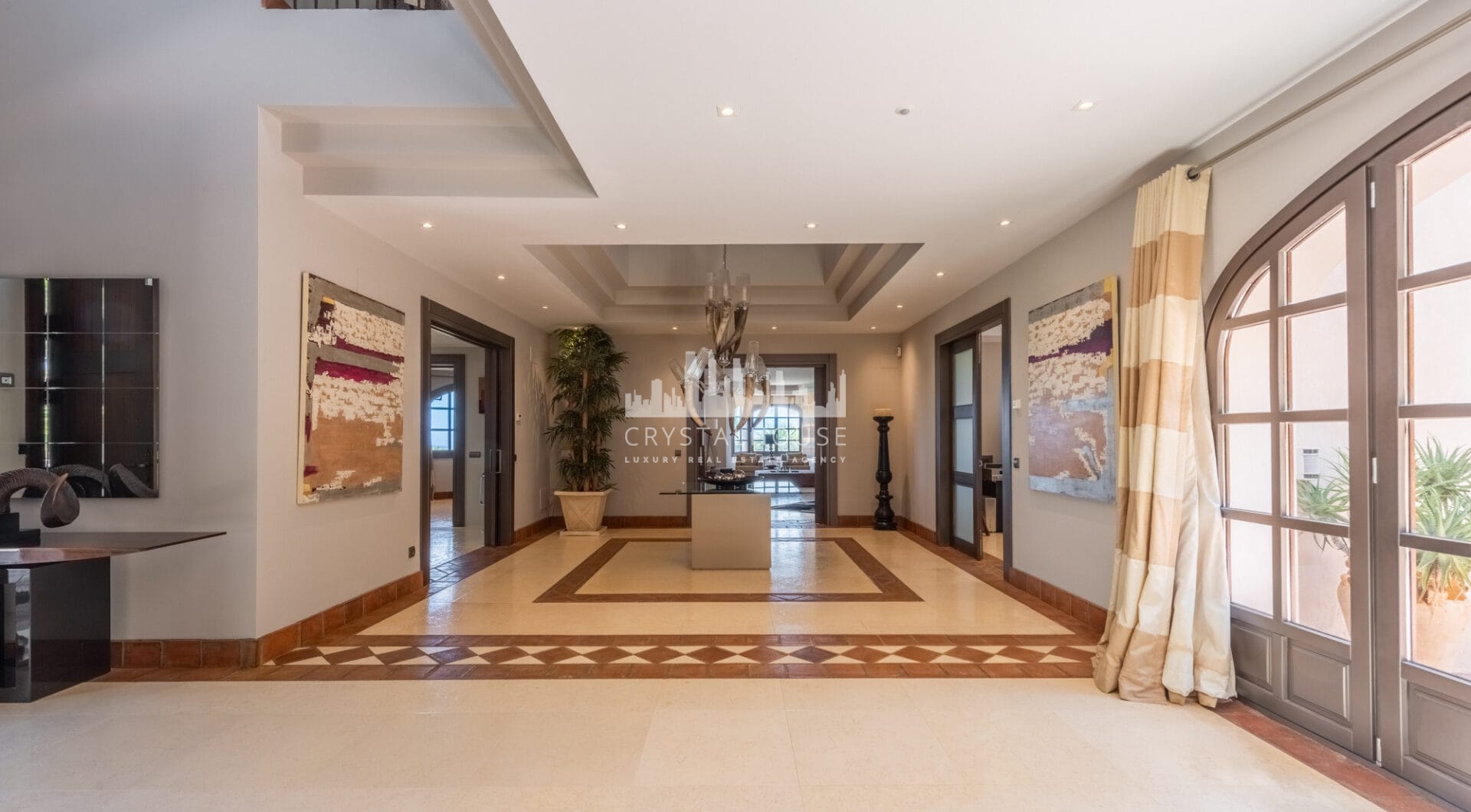 A superb villa built on an elevated site with outstanding panoramic views over golf courses to mountains and the sea.