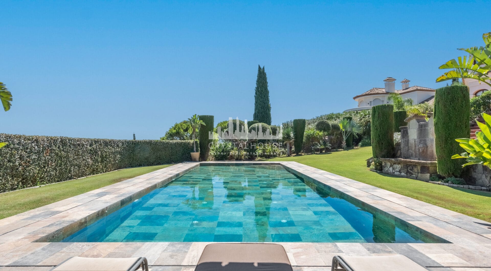 A superb villa built on an elevated site with outstanding panoramic views over golf courses to mountains and the sea.