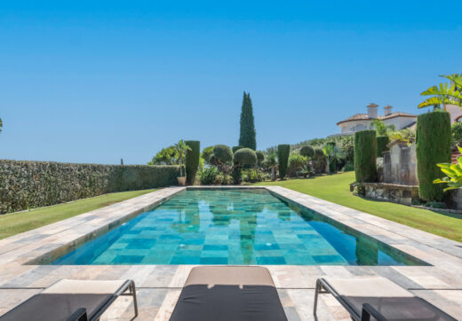 A superb villa built on an elevated site with outstanding panoramic views over golf courses to mountains and the sea.