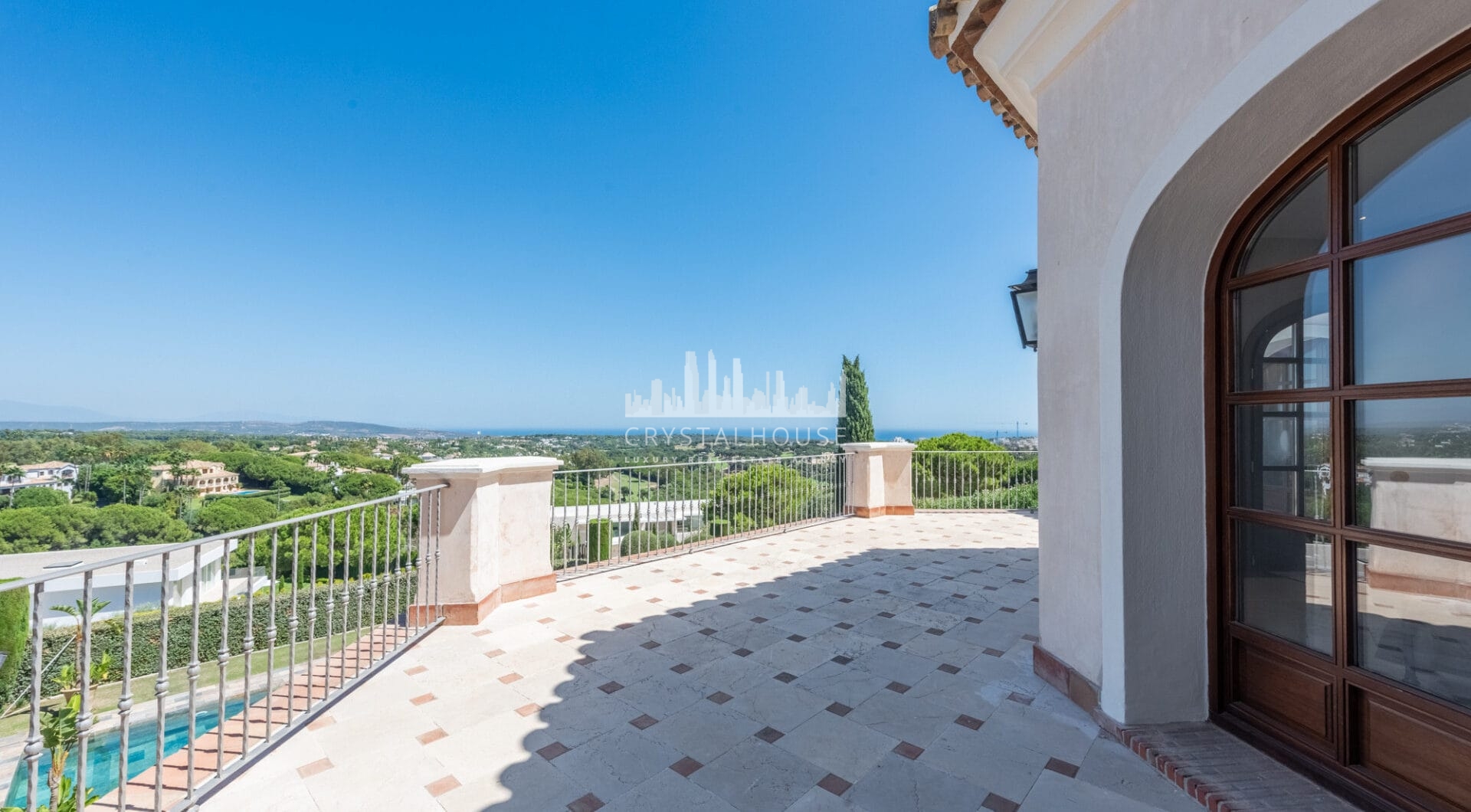 A superb villa built on an elevated site with outstanding panoramic views over golf courses to mountains and the sea.