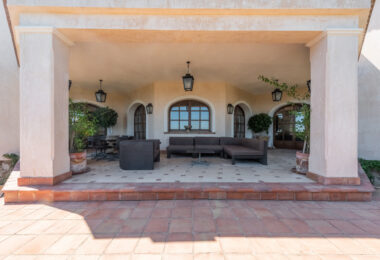 A superb villa built on an elevated site with outstanding panoramic views over golf courses to mountains and the sea.