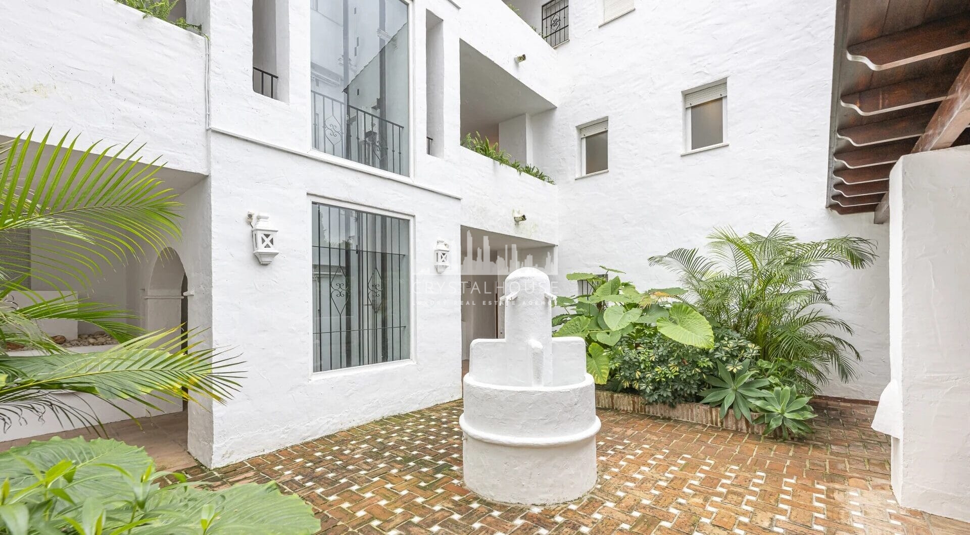 Situated within the sought-after gated community of Urbanización El Corralito, this beautifully maintained first-floor apartment presents a rare opportunity just a few steps from the iconic Mistral Beach.
