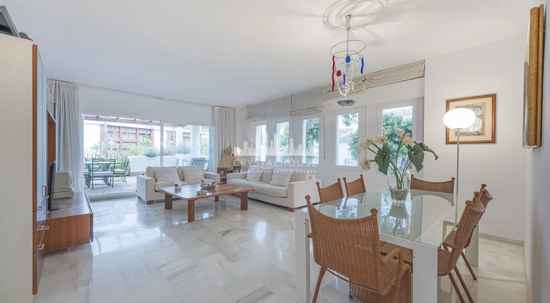 Situated within the sought-after gated community of Urbanización El Corralito, this beautifully maintained first-floor apartment presents a rare opportunity just a few steps from the iconic Mistral Beach.