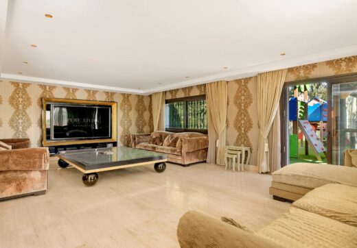 Nestled within the prestigious El Herrojo community, this 7-bedroom, 9-bathroom villa redefines opulent living.