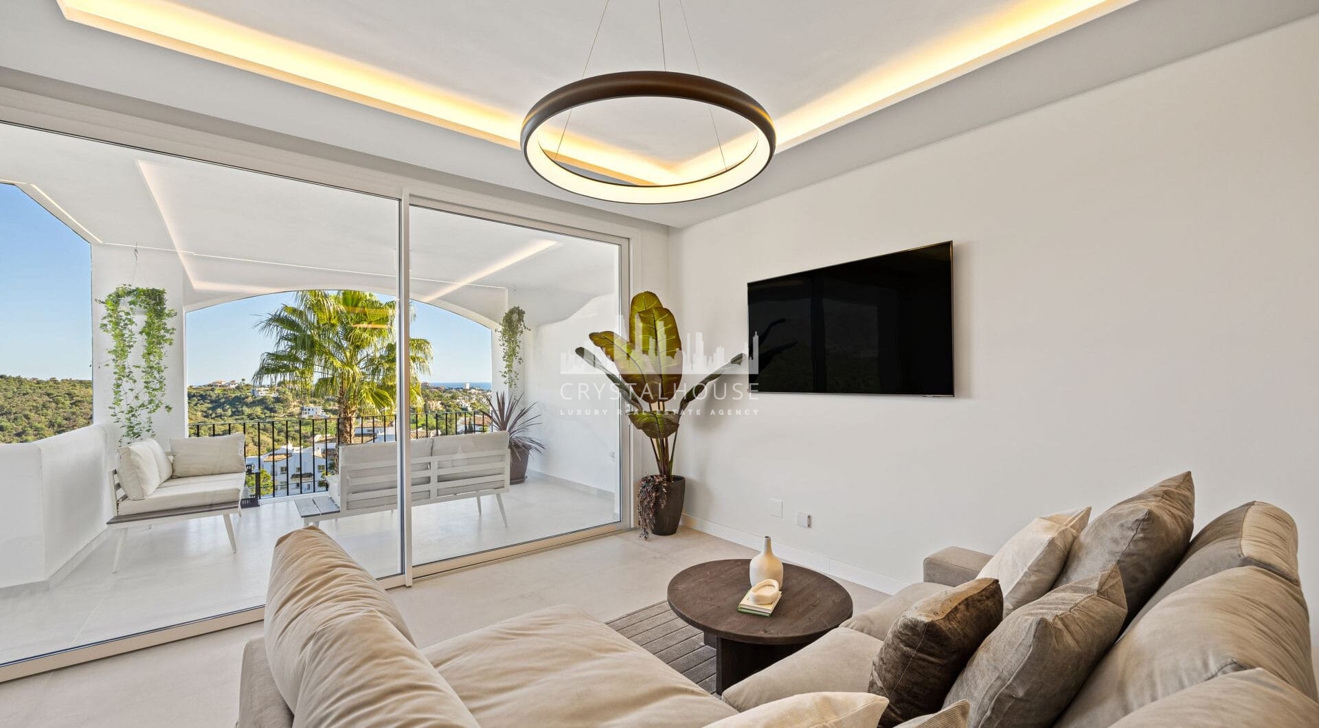 Positioned in the serene hills of Benahavís, this three-bedroom apartment offers elevated living within the secure Altos de la Quinta enclave.