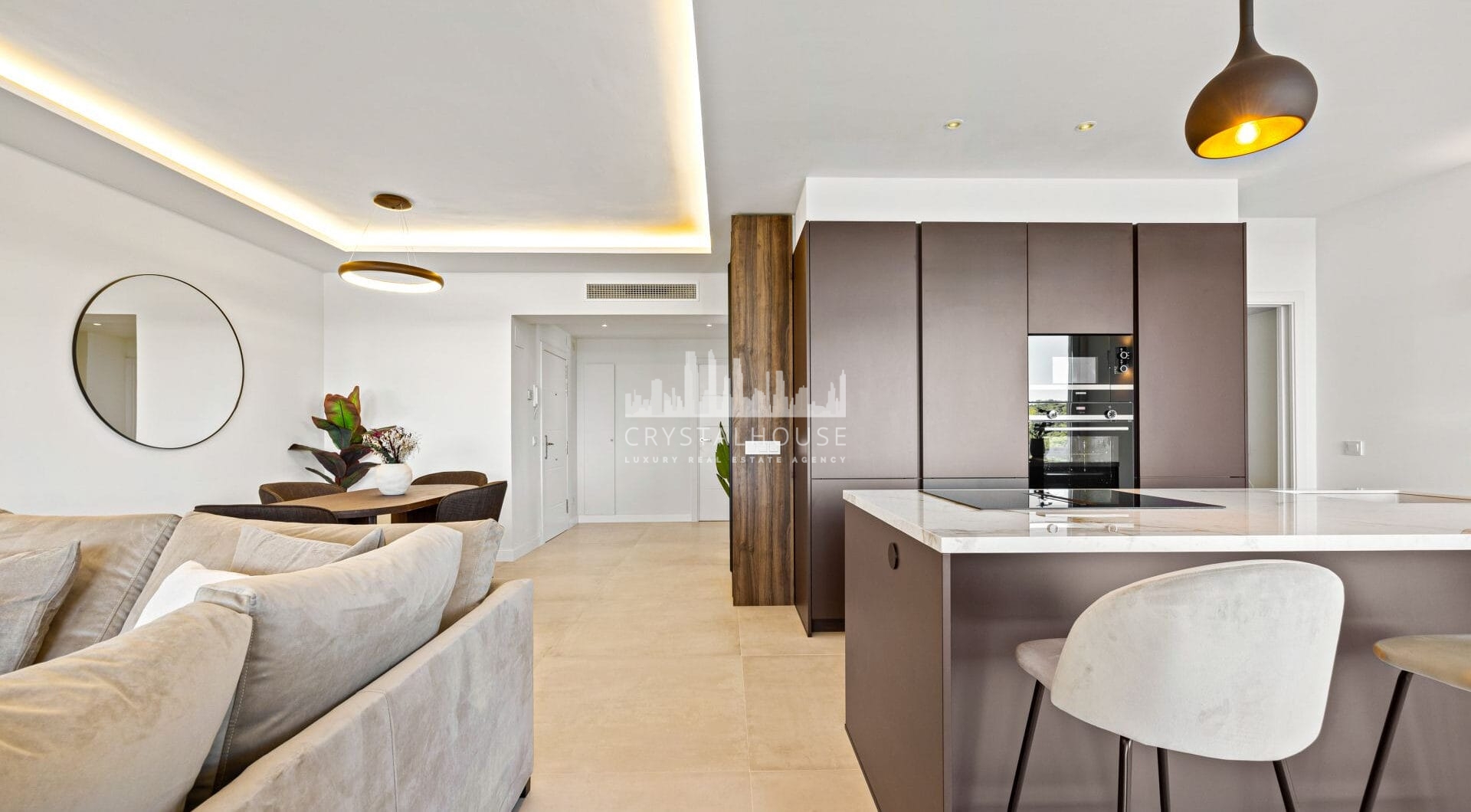 Positioned in the serene hills of Benahavís, this three-bedroom apartment offers elevated living within the secure Altos de la Quinta enclave.