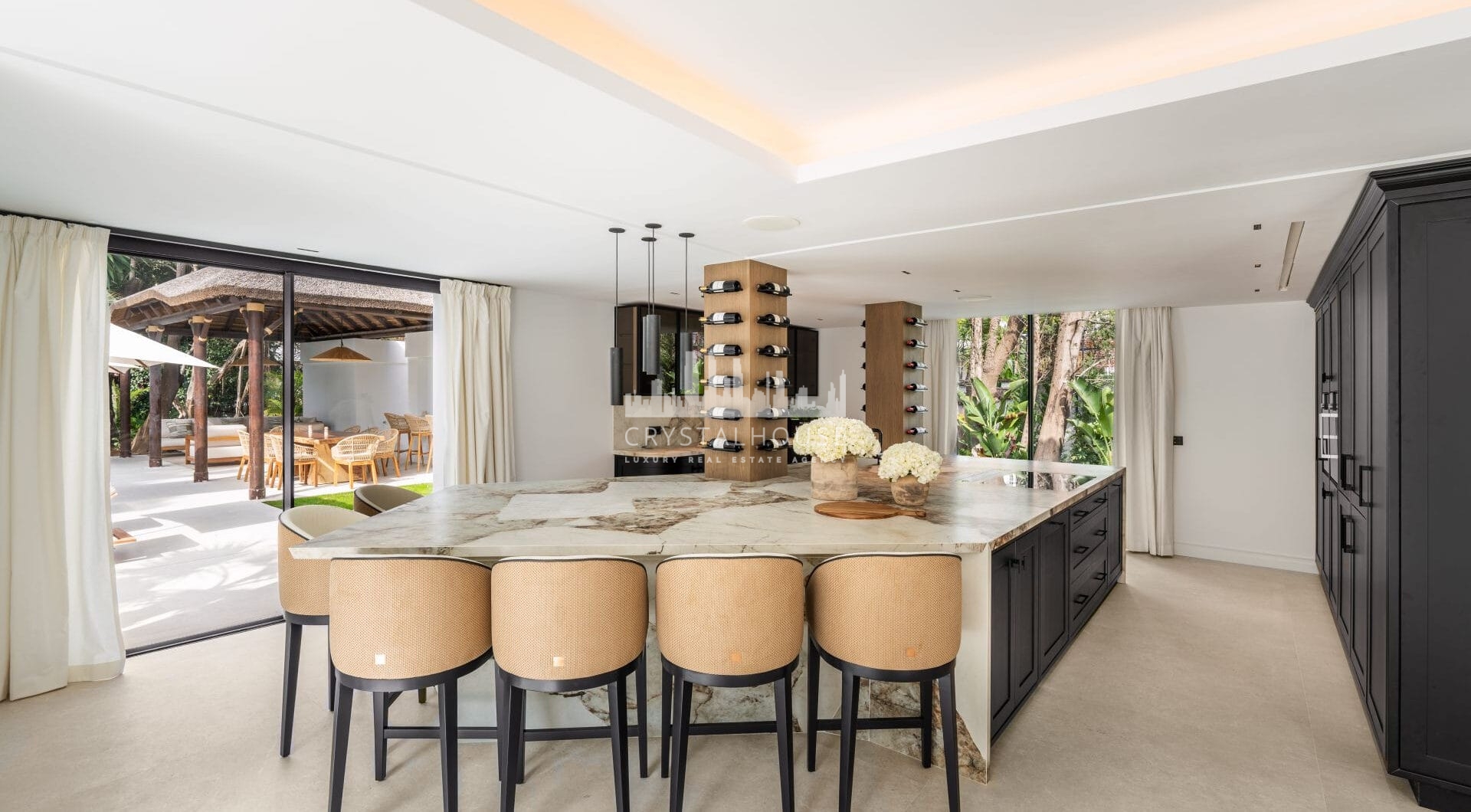 Villa Las Palmeras is a home that combines modern features with traditional details, creating a warm and inviting atmosphere.