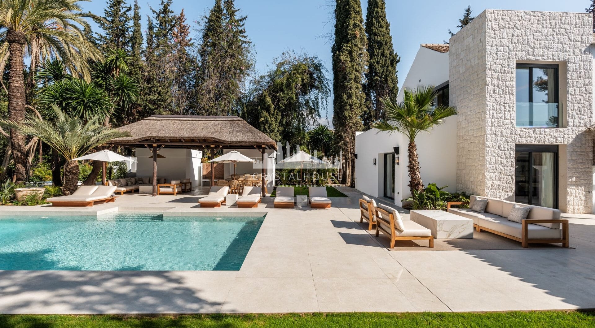 Villa Las Palmeras is a home that combines modern features with traditional details, creating a warm and inviting atmosphere.