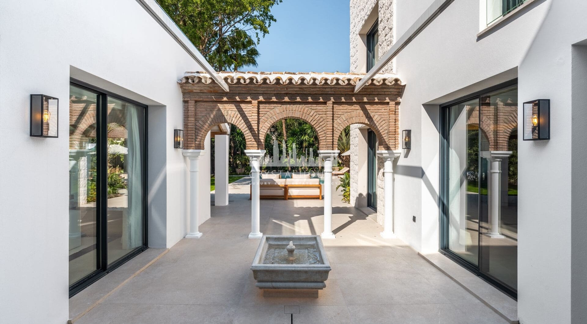 Villa Las Palmeras is a home that combines modern features with traditional details, creating a warm and inviting atmosphere.