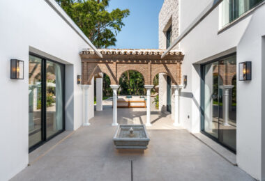Villa Las Palmeras is a home that combines modern features with traditional details, creating a warm and inviting atmosphere.