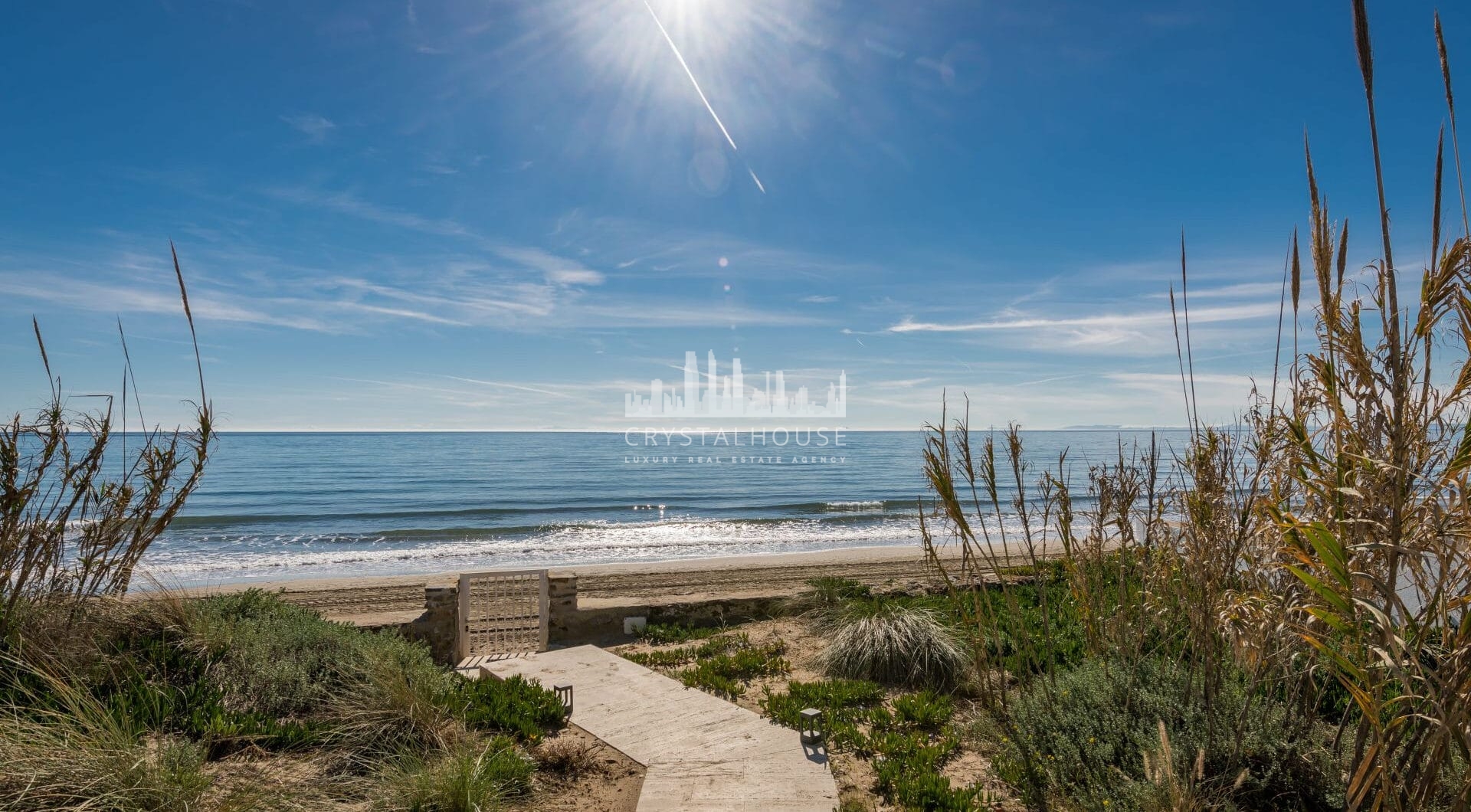 This beachfront villa in Costabella is all about location. Sitting right on the golden sands, it offers direct access to the beach through a private path.