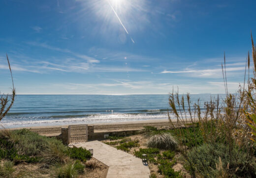 This beachfront villa in Costabella is all about location. Sitting right on the golden sands, it offers direct access to the beach through a private path.