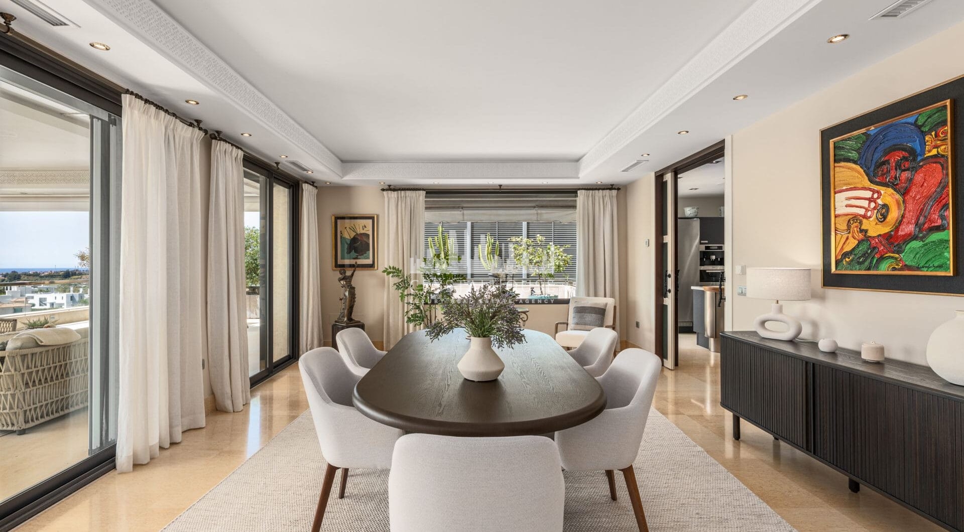 This expansive duplex penthouse is located within the prestigious Los Arrayanes residential complex, in the peaceful and elevated Supermanzana JKL area of Nueva Andalucía.