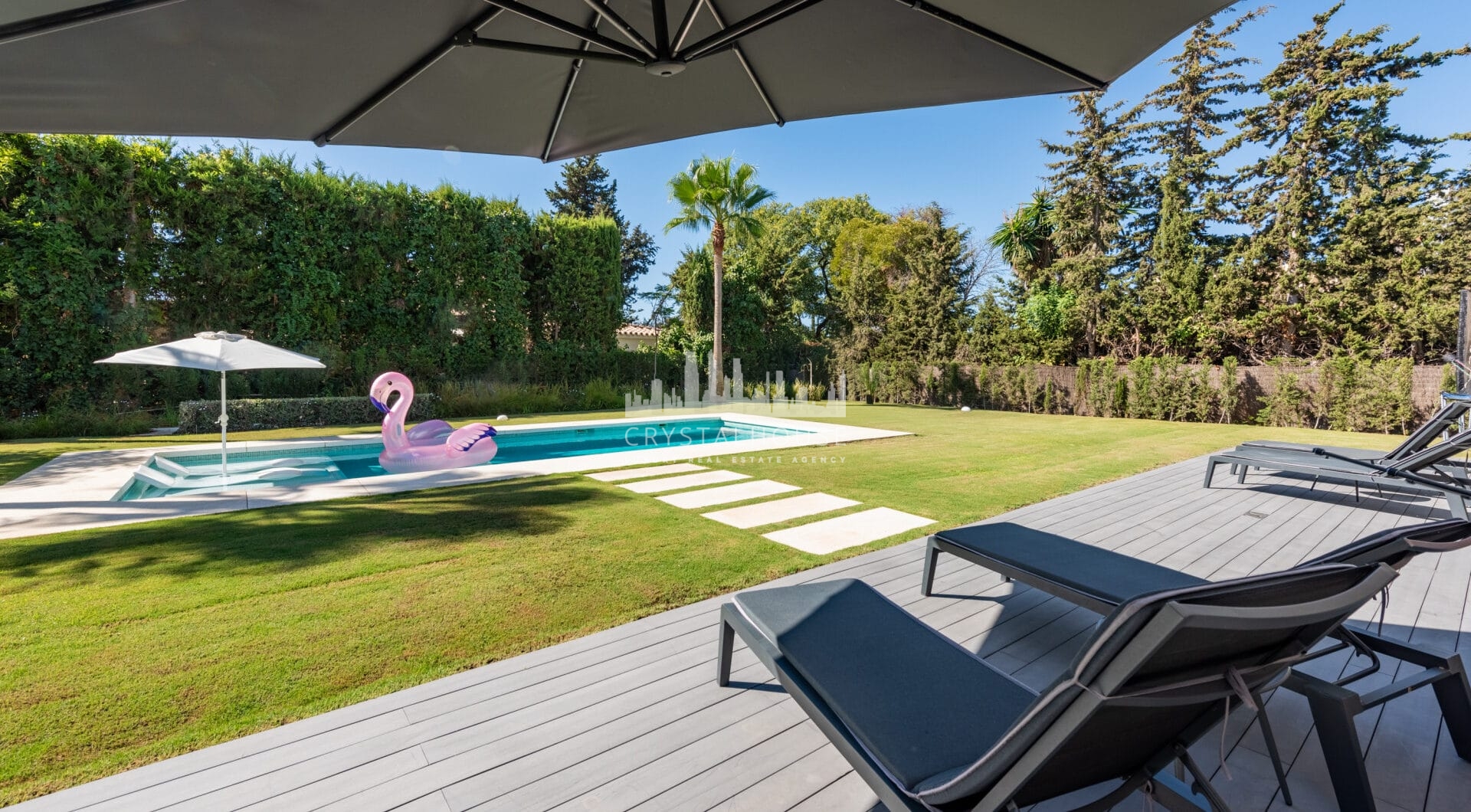 This contemporary four-bedroom detached villa, located in Atalaya Isdabe, is a perfect blend of comfort and luxury