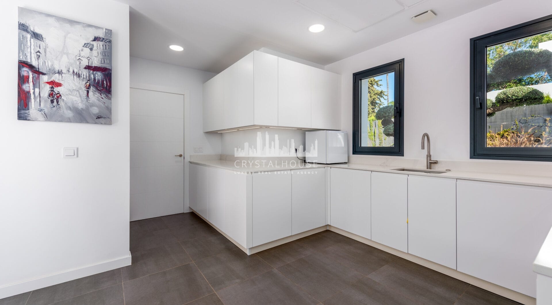 This contemporary four-bedroom detached villa, located in Atalaya Isdabe, is a perfect blend of comfort and luxury