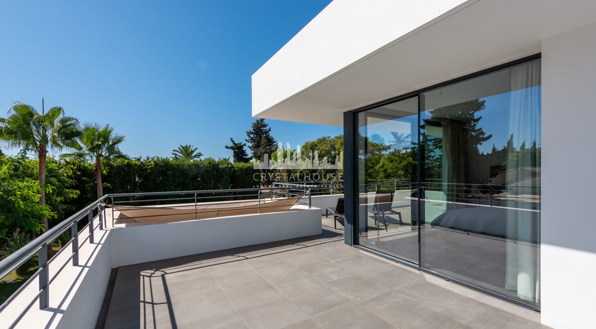 This contemporary four-bedroom detached villa, located in Atalaya Isdabe, is a perfect blend of comfort and luxury
