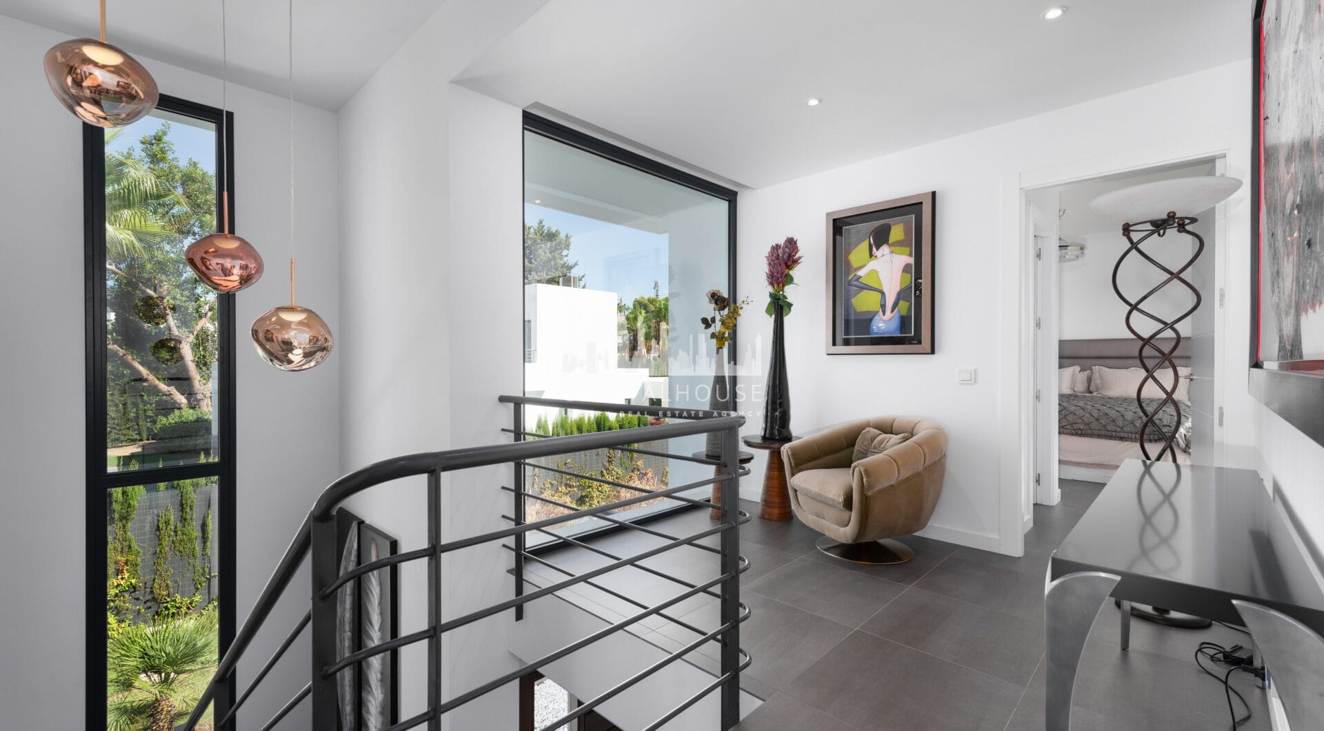 This contemporary four-bedroom detached villa, located in Atalaya Isdabe, is a perfect blend of comfort and luxury