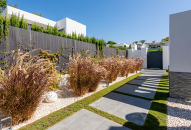 This contemporary four-bedroom detached villa, located in Atalaya Isdabe, is a perfect blend of comfort and luxury