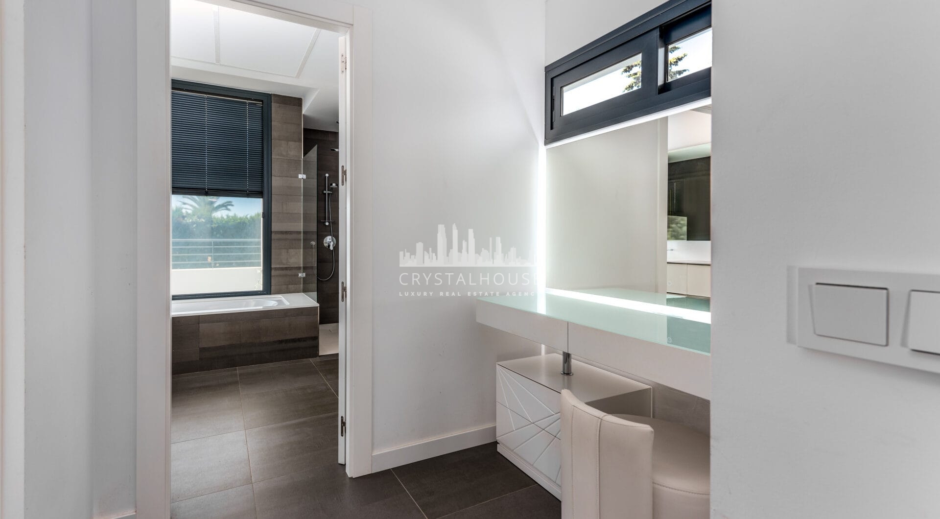 This contemporary four-bedroom detached villa, located in Atalaya Isdabe, is a perfect blend of comfort and luxury