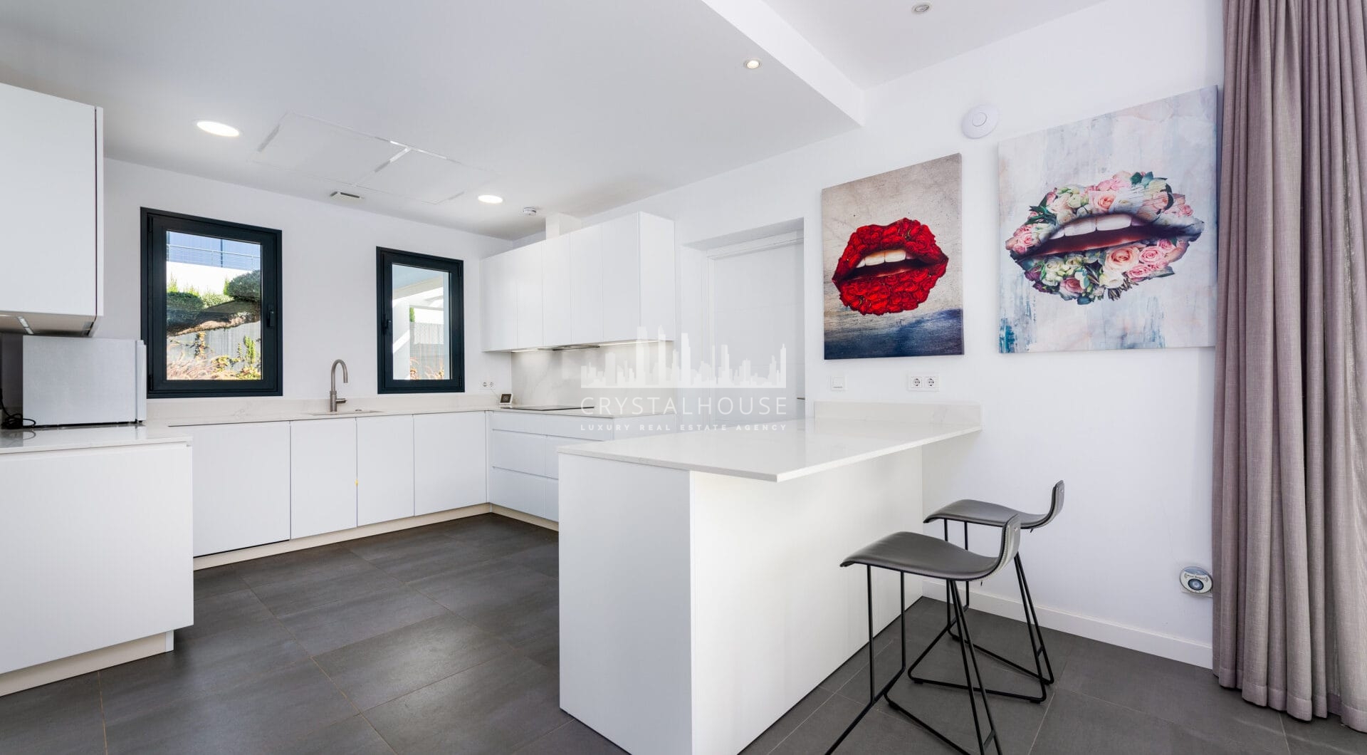 This contemporary four-bedroom detached villa, located in Atalaya Isdabe, is a perfect blend of comfort and luxury