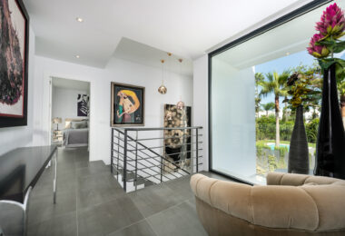 This contemporary four-bedroom detached villa, located in Atalaya Isdabe, is a perfect blend of comfort and luxury