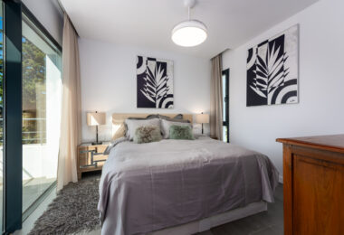 This contemporary four-bedroom detached villa, located in Atalaya Isdabe, is a perfect blend of comfort and luxury
