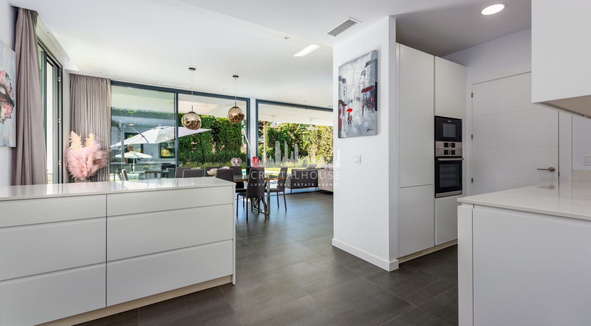 This contemporary four-bedroom detached villa, located in Atalaya Isdabe, is a perfect blend of comfort and luxury