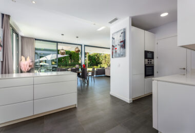 This contemporary four-bedroom detached villa, located in Atalaya Isdabe, is a perfect blend of comfort and luxury