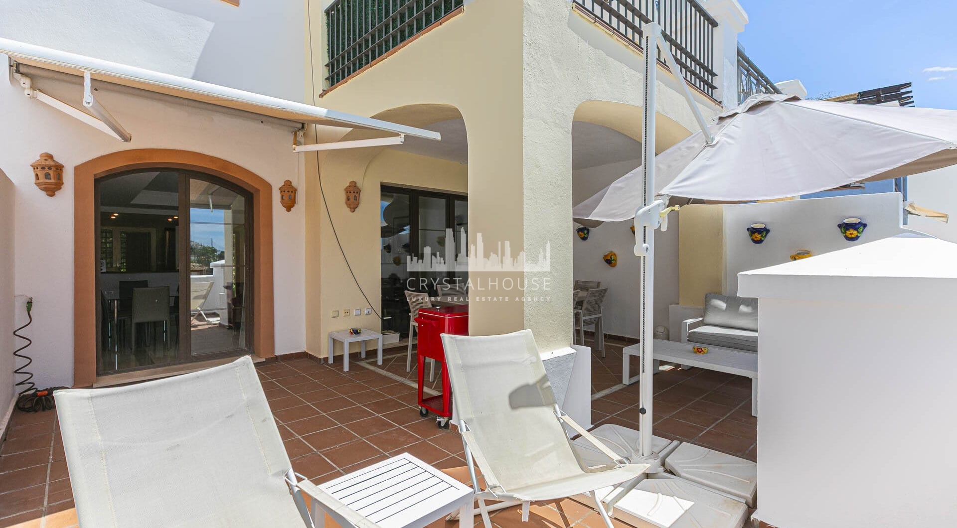Beautiful south-facing, four bedroom townhouse in Los Almendros, part of the secure Los Arqueros Golf community in Benahavís