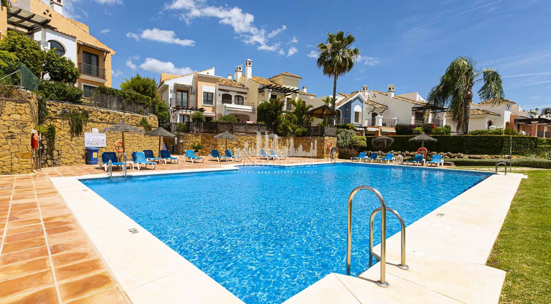 Beautiful south-facing, four bedroom townhouse in Los Almendros, part of the secure Los Arqueros Golf community in Benahavís