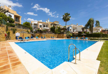 Beautiful south-facing, four bedroom townhouse in Los Almendros, part of the secure Los Arqueros Golf community in Benahavís