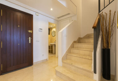 Beautiful south-facing, four bedroom townhouse in Los Almendros, part of the secure Los Arqueros Golf community in Benahavís
