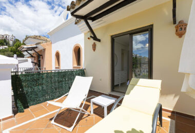 Beautiful south-facing, four bedroom townhouse in Los Almendros, part of the secure Los Arqueros Golf community in Benahavís